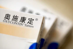 Boxes of OxyContin tablets sold in China sit on a table in Hunan province, Sept. 24, 2019.