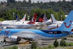 This Aug. 15, 2019, file photo shows dozens of grounded Boeing 737 Max airplanes adjacent to Boeing Field in Seattle.