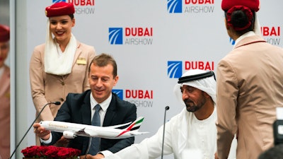 Airbus CEO Guillaume Faury, left, with Sheikh Ahmed bin Saeed Al Maktoum, the chairman and CEO of Emirates, at the Dubai Airshow, Nov. 18, 2019.