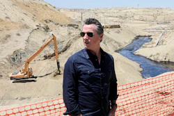 In this July 24, 2019, file photo, Gov. Gavin Newsom tours the Chevron oil field, where a spill of more than 800,000 gallons flowed into a dry creek bed, in McKittrick, Calif.