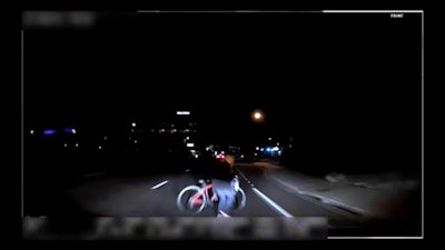 This file image made from video March 18, 2018, of a mounted camera provided by the Tempe Police Department shows an exterior view moments before an Uber SUV hit a woman in Tempe, Ariz.
