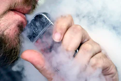 In this Oct. 4, 2019, file photo, a man using an electronic cigarette exhales in Mayfield Heights, Ohio.