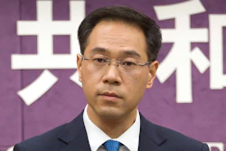 In this March 29, 2018, file photo, Chinese Ministry of Commerce spokesman Gao Feng during a press conference at the Ministry of Commerce in Beijing.
