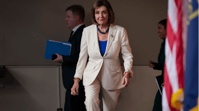 House Speaker Nancy Pelosi, D-Calif., arrives to talk to reporters in Washington.