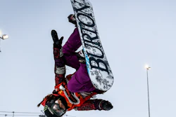 In this Feb. 1, 2015, file photo, Chloe Kim competes during the women's snowboard halfpipe final at the Burton European Open in Laax, Switzerland.