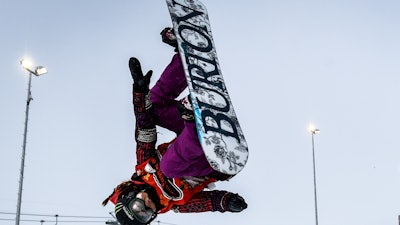 In this Feb. 1, 2015, file photo, Chloe Kim competes during the women's snowboard halfpipe final at the Burton European Open in Laax, Switzerland.