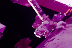 In this photo provided by NASA, Italian astronaut Luca Parmitano and U.S. astronaut Andrew Morgan work to revitalize a cosmic ray detector at the International Space Station, Nov. 22, 2019.