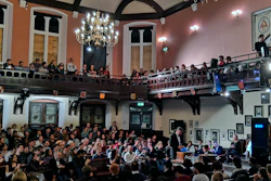In this Nov. 21, 2019, photo, audience members look on during a debate on the threat of artificial intelligence at the Cambridge Union, the world’s oldest debating society, Cambridge, England.