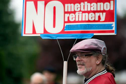 In this 2017 file photo, Mark Keely of Kalama, Wash., stands with other protesters outside the Washington Department of Ecology's Vancouver field office.