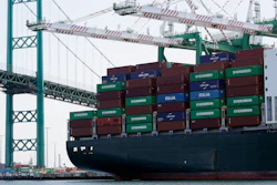 In this June 19, 2019, file photo, a cargo ship is docked at the Port of Los Angeles.