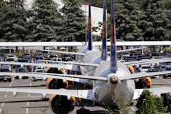 In this Aug. 15, 2019, file photo, three grounded Boeing 737 Max airplanes parked adjacent to Boeing Field in Seattle.
