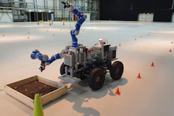 The ANALOG-1 Interact rover located near the European Space Research and Technology Centre in the Netherlands is controlled by a surrogate astronaut based at the European Astronaut Center in Germany. The cones mark out a route that the rover has to follow to get to the sample site.