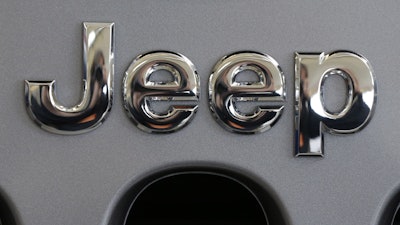 This Feb. 14, 2013, photo shows a Jeep logo at the 2013 Pittsburgh Auto Show.