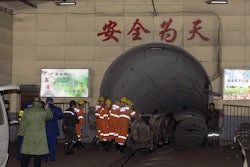 In this photo released by China's Xinhua News Agency, rescuers enter a coal mine that was the site of a gas explosion in Pingyao county in northern China's Shanxi Province, Tuesday, Nov. 19, 2019. Authorities in northern China say more than a dozen people were killed and others injured in a gas explosion inside a coal mine on Monday afternoon.