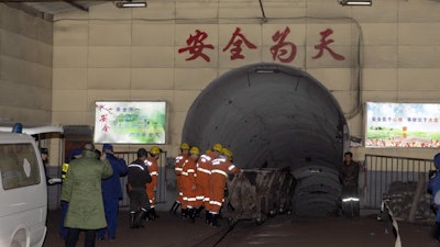 In this photo released by China's Xinhua News Agency, rescuers enter a coal mine that was the site of a gas explosion in Pingyao county in northern China's Shanxi Province, Tuesday, Nov. 19, 2019. Authorities in northern China say more than a dozen people were killed and others injured in a gas explosion inside a coal mine on Monday afternoon.