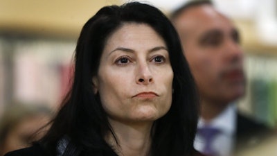 In this March 18, 2019, file photo, Michigan Attorney General Dana Nessel is seen in Clawson, Mich. Nessel plans a crackdown on illegal robocalls. On Friday, Nov. 15, 2019, she announced a dozen initiatives aimed at putting a halt to the calls, many of which she says are scams.