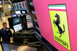 The logo for Ferrari is displayed above a trading post on the floor of the New York Stock Exchange, Aug. 1, 2018.