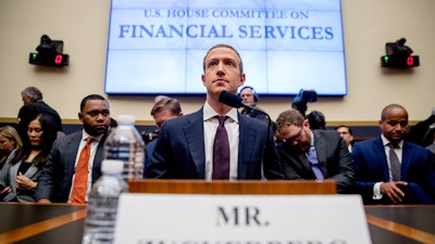 In this Oct. 23, 2019 photo, Facebook CEO Mark Zuckerberg arrives for a House Financial Services Committee hearing on Capitol Hill in Washington. Zuckerberg’s social network in Washington is shrinking. Bipartisan hostility against Facebook has been building for months, fueled by a series of privacy scandals, the site’s use by Russian operatives in the 2016 presidential campaign and accusations that Facebook crushes competitors. Now, with the 2020 elections approaching, Democrats especially are homing in on the conduct of the social media giant and its refusal to fact-check political ads and remove false ones.