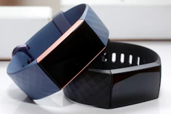 In this Aug. 16, 2018, file photo, the Fitbit Charge 3 fitness trackers are displayed in New York. Google’s parent company is buying wearable device maker Fitbit for about $2.1 billion. Alphabet said Friday, Nov. 1, 2019, that it will pay $7.35 per share.