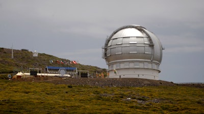 This July 24, 2009 file photo shows the Gran Telescopio Canarias, one of the the world's largest telescopes, at the Observatorio del Roque de los Muchachos on the Canary Island of La Palma, Spain. The director of a Spanish research center says a giant telescope, costing $1.4 billion, is one step nearer to being built on the Canary Islands in the event an international consortium gives up its plans to build it in Hawaii.