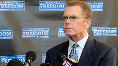 In this Feb. 2, 2018, file photo, Douglas Haig takes questions from reporters at a news conference in Chandler, Ariz. Haig plans to plead guilty in a federal case in Nevada alleging he illegally manufactured ammunition sold to the gunman who carried out the Las Vegas Strip massacre in October 2017. A court notice posted Tuesday, Nov. 12, 2019, set a change-of-plea hearing next week for Haig in Las Vegas, ahead of trial scheduled next month.