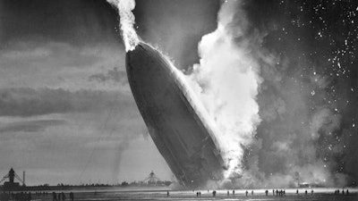 In this May 6, 1937 file photo, the German dirigible Hindenburg crashes to earth in flames after exploding at the U.S. Naval Station in Lakehurst, N.J. Werner Gustav Doehner, the last survivor of the disaster, died Nov. 8, 2019 at age 90 in Laconia, N.H. Doehner was 8-years old when he boarded the zeppelin in Germany with his parents and older siblings to return from a vacation.