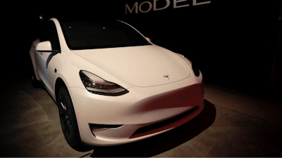 In this March 14, 2019, file photo Tesla CEO Elon Musk speaks before unveiling the Model Y at Tesla's design studio in Hawthorne, Calif. Tesla CEO Elon Musk says the electric car pioneer plans to build a new factory near Berlin. News agency dpa reported that Musk made the announcement during a prizegiving ceremony in the German capital Tuesday evening.