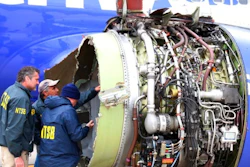 National Transportation Safety Board investigators examine damage to the engine of the Southwest Airlines plane that made an emergency landing at Philadelphia International Airport in Philadelphia on Tuesday, April 17, 2018. The Southwest Airlines jet blew the engine at 32,000 feet and got hit by shrapnel that smashed a window, setting off a desperate scramble by passengers to save a woman from getting sucked out. She later died, and seven others were injured.