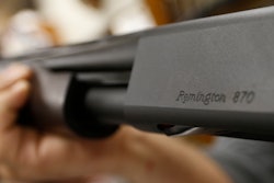 In this March 1, 2018 file photo, the Remington name is seen etched on a model 870 shotgun at Duke's Sport Shop in New Castle, Pa. For years, the gun industry has been immune from most lawsuits, but a recent ruling allowing families of victims in the Newton school shooting to challenge the way an AR-15 used by the shooter was marketed is upending that longstanding roadblock. The U.S. Supreme Court recently rejected efforts by gunmaker Remington to quash the lawsuit, allowing it to continue to be heard in Connecticut courts.