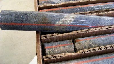 In this Oct. 4, 2011, file photo, a core sample drilled from underground rock near Ely, Minn., shows a band of shiny minerals containing copper, nickel and precious metals, center, that Twin Metals Minnesota LLC, hopes to mine near the Boundary Waters Canoe Area Wilderness in northeastern Minnesota. Minnesota officials say they will do a state environmental impact statement for a proposed copper-nickel mine upstream of the Boundary Waters Canoe Area.