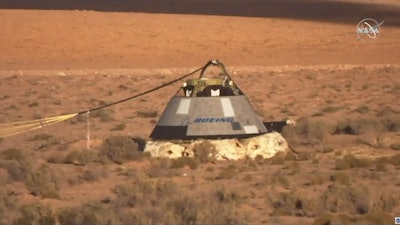 In this image made from a video provided by NASA the Starliner capsule rests on the ground after a test of Boeing's crew capsule launch abort system in White Sands Missile Range in N.M., on Monday, Nov. 4, 2019. Cochise County Arizona officials are hearing about possible emergency responses and road closures that might be required if the new reusable space capsule lands by parachute on a flat desert grassland.