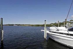In this Nov. 30, 2017 photo, boats are shown moored in the Anclote River near the old Stauffer chemical plant site in Tarpon Springs, Fla. Hundreds of the nation's most polluted places are at an increasing risk of spreading contamination beyond their borders by more frequent storms and rising seas. Sixty percent of U.S. Superfund sites are in danger from weather extremes like hurricanes or wildfires, and the Trump administration’s reluctance to acknowledge and plan for climate change is hurting chances of safeguarding them, according to a government watchdog.