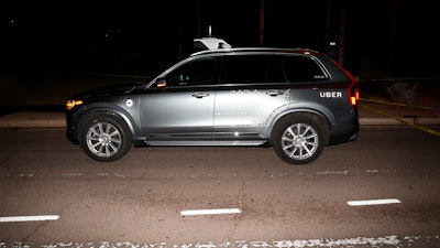 This March 18, 2018 file image provided by the Tempe Police Department shows an Uber SUV after hitting a woman in Tempe, Ariz. Documents released Tuesday, Nov. 5, 2019 by the National Transportation Safety Board raise questions about whether a self-driving Uber SUV that ran down a pedestrian last year should have been allowed on public roads for test purposes.