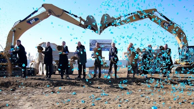 Tennessee officials, Chattanooga officials and Volkswagen officials pose for a photo during the groundbreaking event for the Volkswagen electric vehicle facility at the Volkswagen plant Wednesday, Nov. 13, 2019 in Chattanooga, Tenn. Volkswagen is making Tennessee its North American base for electric vehicle production, breaking ground on an $800 million expansion at the plant in Chattanooga.