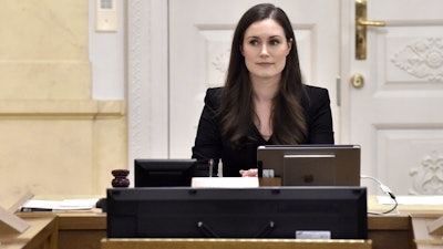 Prime Minister of Finland Sanna Marin, center, chairs her first government meeting in Helsinki, Dec. 10, 2019.