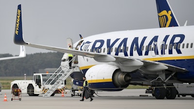 In this Sept. 12, 2018 file photo, a Ryanair plane parks at the airport in Weeze, Germany.