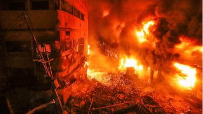 Flames rise from a fire in a densely packed shopping area in Dhaka, Bangladesh, Feb. 21, 2019.