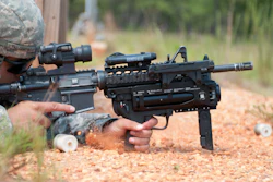 A U.S. Army paratrooper fires a training round from an M320 grenade launcher at a range in Fort Bragg, N.C., July 1, 2009.