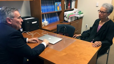 In this May 24, 2018, photo, Adine Usher, 78, meets with breast cancer study leader Dr. Joseph Sparano at the Montefiore and Albert Einstein College of Medicine in the Bronx.