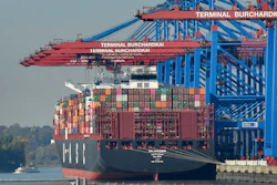 In this Oct. 15, 2018, file photo, a container ship is loaded at the harbor in Hamburg, Germany.