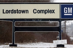 In this March 6, 2019, file photo, a 'Save Me' sign rests against the General Motors Lordstown Complex sign in Lordstown, Ohio.