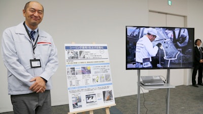 Nissan engineer Makoto Yamada talks to reporters during a press conference at the company's headquarters, Nov. 28, 2019, in Yokohama, Japan.