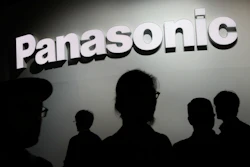 In this Jan. 9, 2018, file photo, people walk by the Panasonic booth during CES International in Las Vegas.
