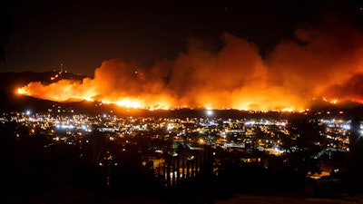 In this Oct. 31, 2019, file photo, smoke from the Maria Fire billows above Santa Paula, Calif.