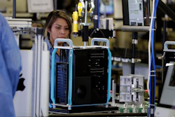 In this Nov. 20, 2019, file photo, workers assemble Apple products in Austin, Texas.