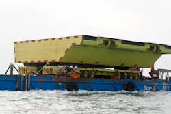 A yellow barrier, part of a plan to protect the city of Venice from flooding, floats on a barge, in Venice, Nov. 29, 2019.