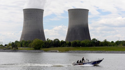 In this April 29, 2015, file photo, a boat travels on the Tennessee River near the Watts Bar Nuclear Plant near Spring City, Tenn.