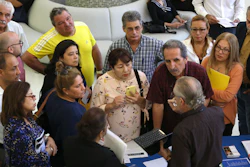 In this Sept. 18, 2019, file photo, people inquire about temporary positions available for the 2020 Census during a job fair in Miami.
