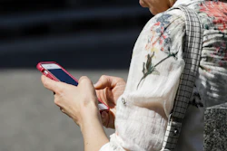 In this April 8, 2019, file photo, a woman browses her smartphone in Philadelphia.