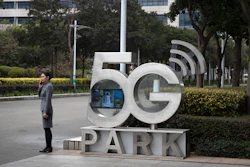 A Huawei employee talks on her cellphone at Huawei's campus in Shenzhen, Dec. 5, 2019.